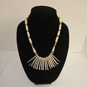 Gently worn cream colored necklace.
